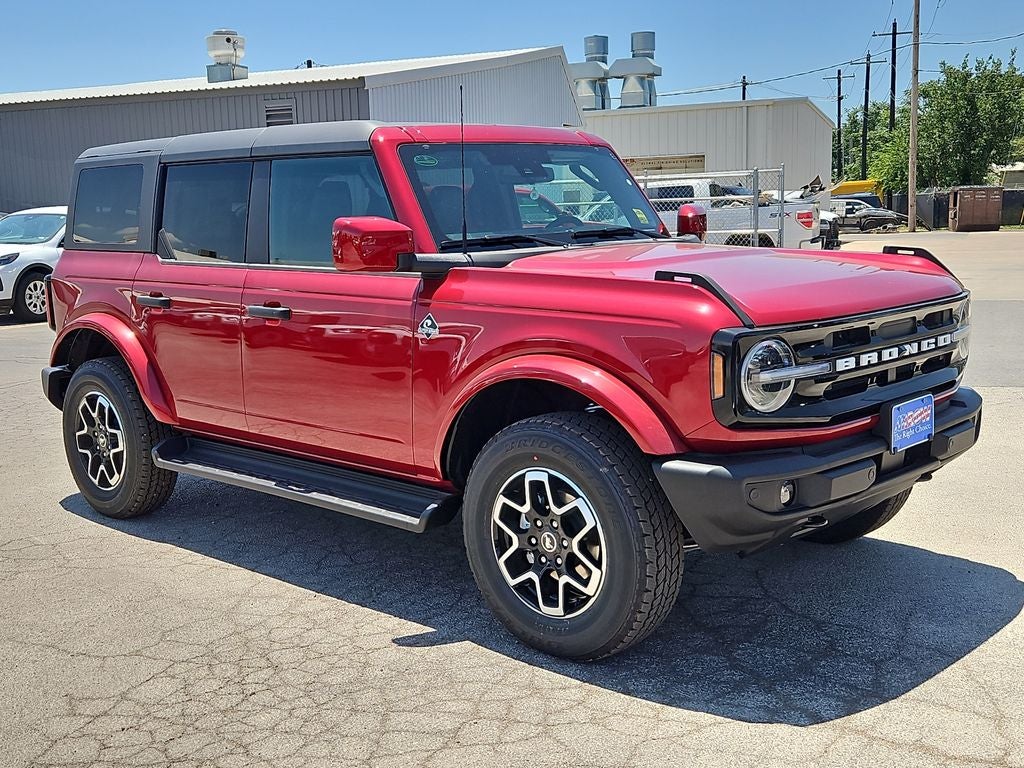 2026 Ford Bronco Outer Banks in Ruby Red Metallic — front three-quarter view
